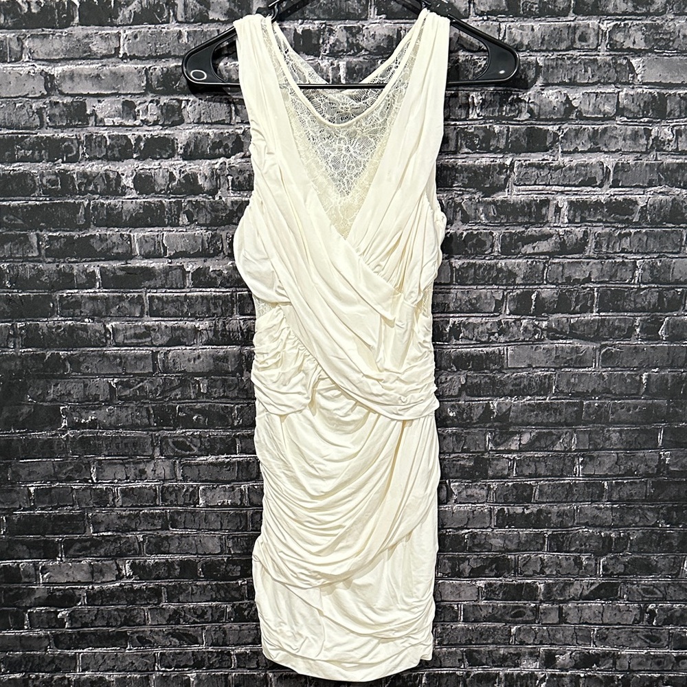 bebe Bone White ruched mini dress with lace cut outs!